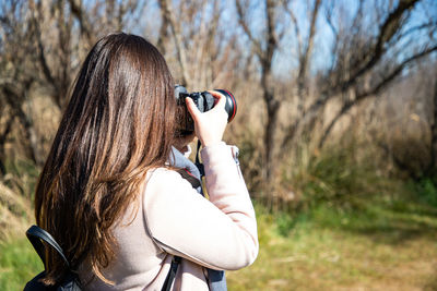 Side view of young woman looking away