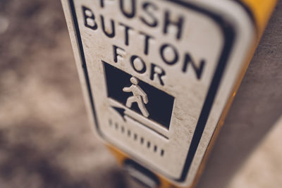 Close-up of pedestrian crossing sign