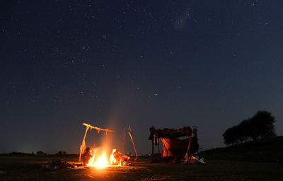 People at night against sky