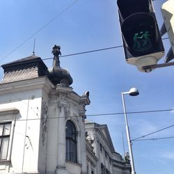 Low angle view of building against blue sky