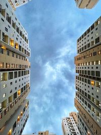 Low angle view of buildings in city against sky