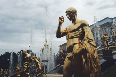 Statue in front of fountain