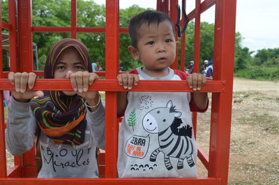 Full length of cute boy standing in park