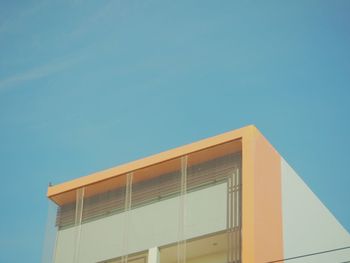 Low angle view of building against clear blue sky