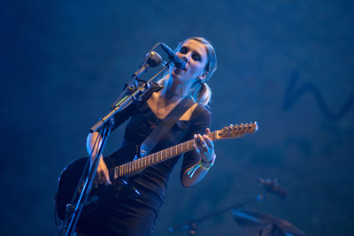 Man playing guitar at music concert