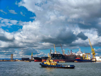 Boats in sea against sky