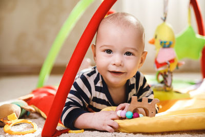 Close-up of cute boy playing with toy