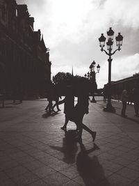 City street against cloudy sky