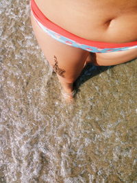 Low section of woman on beach