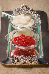 High angle view of strawberries in glass jar on table