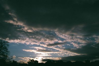 Low angle view of silhouette trees against sky during sunset