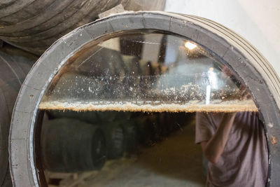 Close-up of person seen through window