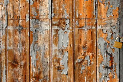 Full frame shot of weathered wooden door