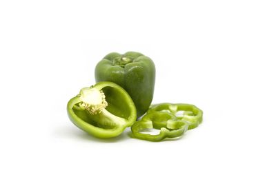 Close-up of green bell pepper against white background