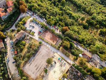 High angle view of trees and buildings in city