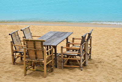 Chairs on table at beach