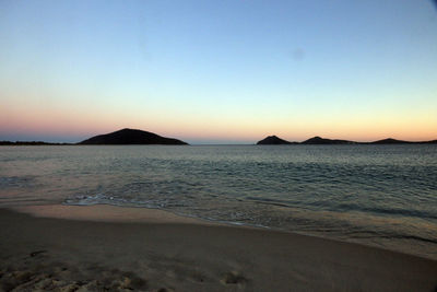 Scenic view of sea against clear sky during sunset