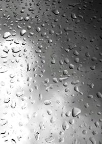 Full frame shot of wet glass window