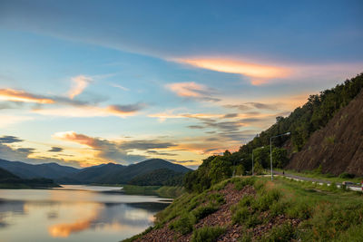 Scenic view of lake against sky during sunset