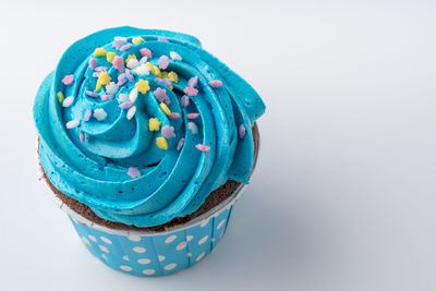 Close-up of cupcakes against white background