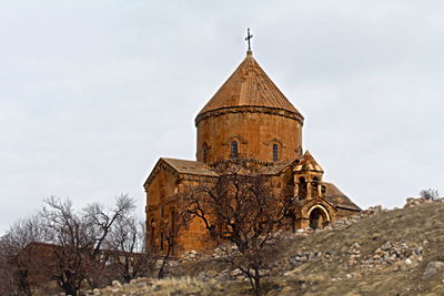 Low angle view of old temple against sky