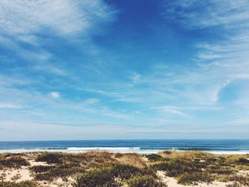 Scenic view of sea against cloudy sky