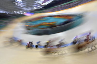 Blurred motion of people riding bicycles