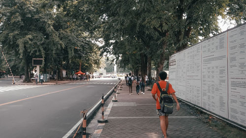 People walking on road in city