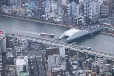 High angle view of river amidst buildings in city