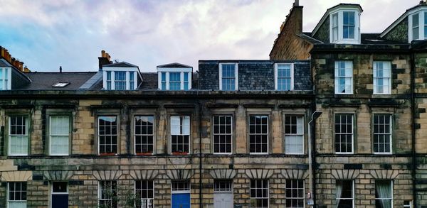 Low angle view of residential building against sky
