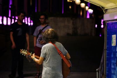Rear view of people at music concert