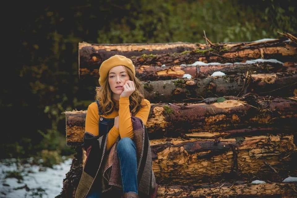 one person, clothing, women, adult, nature, autumn, smiling, young adult, forest, portrait, happiness, tree, front view, leisure activity, winter, hat, emotion, looking at camera, lifestyles, warm clothing, hairstyle, land, long hair, outdoors, casual clothing, plant, blond hair, day, female, scarf, cold temperature, looking, standing, landscape, three quarter length, rural scene, relaxation, fashion, beauty in nature, cheerful