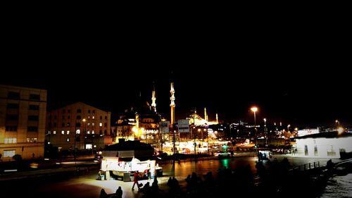 Boats in harbor at night