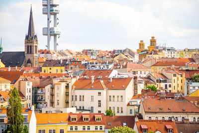 Buildings in town against sky