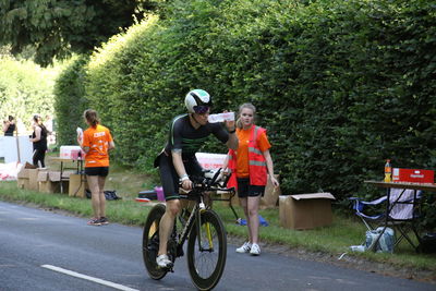 People riding bicycle on road