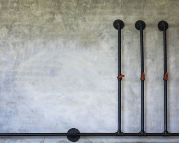 Cement wall decorated with black spraying water pipes