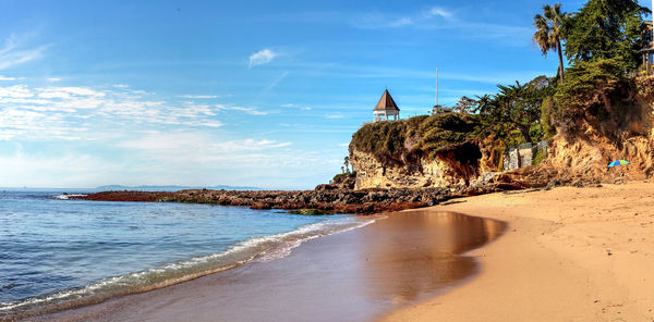 View of beach against cloudy sky