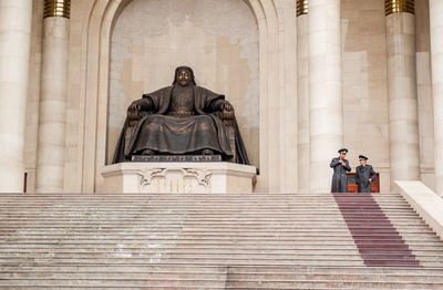 Low angle view of statue against building