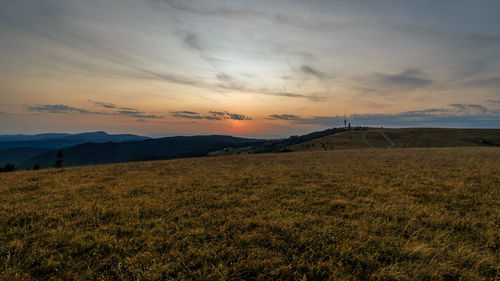 Scenic view of landscape against sky during sunset
