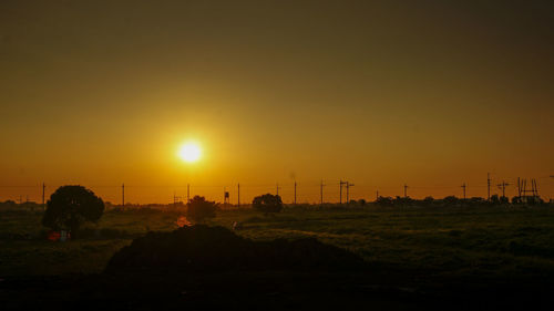 Silhouette landscape against sky during sunset