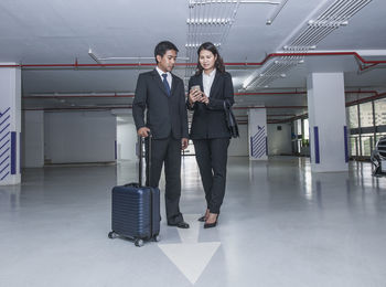 Men standing at airport