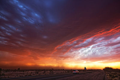 Scenic view of dramatic sky during sunset