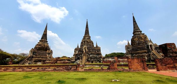 Old temple building against sky