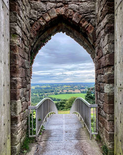 View of arched bridge against cloudy sky