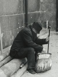 Side view of a man sleeping on floor