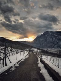 Scenic view of frozen lake against sky during sunset
