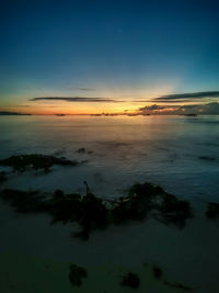 Scenic view of sea against sky at sunset