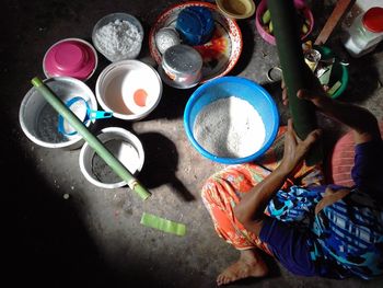 High angle view of paintbrushes in bowl