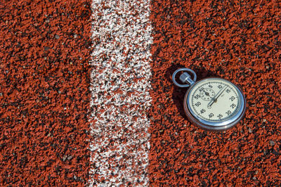 Close-up of stopwatch on field