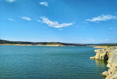 Scenic view of sea against blue sky